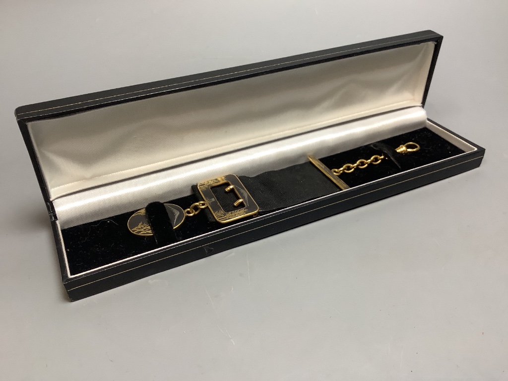 A Japanese komai style gold and silver damascened iron watch fob circa 1900